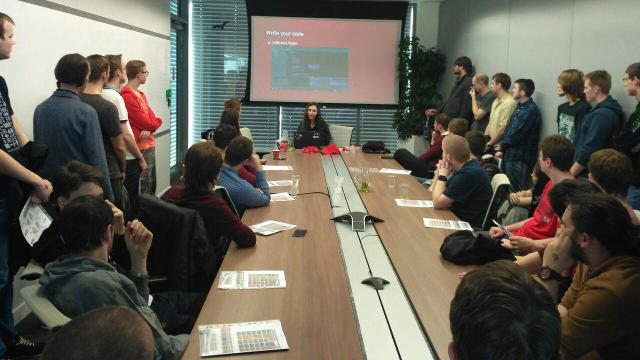 Photo of Radka speaking - about to write some code